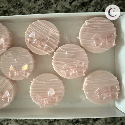 Chocolate cupcakes decorated with pink chocolate.